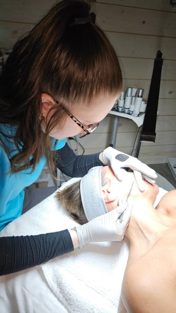 A Bare Beauty specialist performing a laser skin rejuvenation treatment